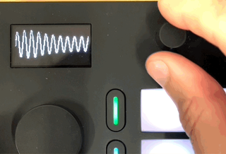 Animated GIF showing the two User Views — envelope display and LFO waveform — being switched between using the track buttons